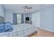Spacious main bedroom featuring a ceiling fan and double closet at 2746 Birchcreek Dr, Wesley Chapel, FL 33544