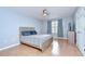 Bedroom with hardwood floors, a ceiling fan, and a double bed at 2746 Birchcreek Dr, Wesley Chapel, FL 33544
