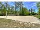 Sand volleyball court on a sunny day, perfect for recreational play at 2746 Birchcreek Dr, Wesley Chapel, FL 33544