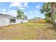 Spacious backyard featuring new fence and lush green space, perfect for outdoor activities at 2901 Forestwood Dr, Seffner, FL 33584