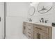 Bright bathroom featuring a double vanity with marble countertop and modern fixtures at 2901 Forestwood Dr, Seffner, FL 33584
