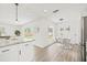 Bright dining area with modern lighting and a view of the backyard at 2901 Forestwood Dr, Seffner, FL 33584