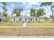 Beautiful single-story home features a vibrant blue front door and well-manicured lawn at 2901 Forestwood Dr, Seffner, FL 33584