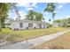 Charming single-story home with lush lawn, large windows and clean landscaping at 2901 Forestwood Dr, Seffner, FL 33584
