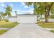 Picture of attached two car garage with freshly painted white walls at 2901 Forestwood Dr, Seffner, FL 33584