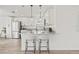 Modern kitchen with white cabinets, stainless steel appliances, and a breakfast bar for casual dining at 2901 Forestwood Dr, Seffner, FL 33584