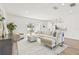 Spacious living room boasts ample natural light, stylish furnishings, and an open floor plan with backyard views at 2901 Forestwood Dr, Seffner, FL 33584