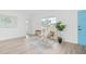 Brightly lit living area with stylish seating, large windows, and contemporary accents at 2901 Forestwood Dr, Seffner, FL 33584