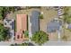Aerial view of the home's roof, street, and adjacent properties and neighborhood at 3215 E Powhatan Ave, Tampa, FL 33610