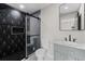 Modern bathroom features stylish tile, glass shower, and a sleek vanity at 3215 E Powhatan Ave, Tampa, FL 33610