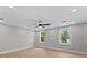 Bright bedroom featuring wood flooring, recessed lighting, and a ceiling fan at 3215 E Powhatan Ave, Tampa, FL 33610