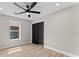 Bedroom features light colored walls, wood floors, recessed lighting, and a closet at 3215 E Powhatan Ave, Tampa, FL 33610