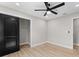 Bedroom featuring wood flooring, recessed lighting, and a closet with sliding door at 3215 E Powhatan Ave, Tampa, FL 33610