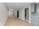 Bright hallway features light floors and neutral walls, leading to a well-appointed bathroom at 3215 E Powhatan Ave, Tampa, FL 33610