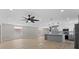 Stylish open concept living space with new kitchen featuring a large island with pendant lighting at 3215 E Powhatan Ave, Tampa, FL 33610