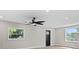 Bright living room with lots of light, fresh paint, modern ceiling fan and stylish flooring at 3215 E Powhatan Ave, Tampa, FL 33610