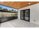 This porch has a wood ceiling, tile flooring, and is screened-in with a view of the yard at 3215 E Powhatan Ave, Tampa, FL 33610