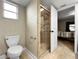 Tiled bathroom featuring glass-door walk-in shower and a toilet at 3508 Yale Cir, Riverview, FL 33578