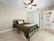 Cozy bedroom featuring a ceiling fan, tile floors and a closet with sliding doors at 3508 Yale Cir, Riverview, FL 33578