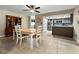 Inviting dining room featuring tile flooring and an open view into the modern kitchen at 3508 Yale Cir, Riverview, FL 33578