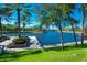 Scenic waterfront view with lush greenery, a pier, and calm waters at 37 W Boyer St, Tarpon Springs, FL 34689