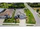 Expansive aerial view showcases manicured lawn, paved driveway, and the surrounding neighborhood at 3727 Wild Blossom Pl, Parrish, FL 34219