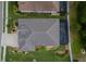Aerial shot of a well-maintained property with a private screened pool and manicured lawn at 3727 Wild Blossom Pl, Parrish, FL 34219