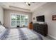 Relaxing bedroom with large windows, neutral colors and a built-in dresser at 3727 Wild Blossom Pl, Parrish, FL 34219