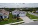 Beautiful single-story home with a three-car garage, paver driveway and lush landscaping at 3727 Wild Blossom Pl, Parrish, FL 34219