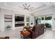 Open living space with a contemporary fireplace and a sliding glass door that lets in plenty of light at 3727 Wild Blossom Pl, Parrish, FL 34219