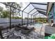 Tranquil pool area enclosed with a screen, chaise lounge, and manicured landscaping for ultimate relaxation at 3727 Wild Blossom Pl, Parrish, FL 34219