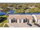An aerial view of a condo building overlooking a serene lake, showcasing picturesque waterfront community at 3823 N Oak Dr # K22, Tampa, FL 33611