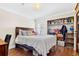 Comfortable bedroom features wood flooring and a large closet at 3823 N Oak Dr # K22, Tampa, FL 33611