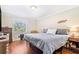 Comfortable bedroom with hardwood floors, natural light, and ample space for a relaxing retreat at 3823 N Oak Dr # K22, Tampa, FL 33611