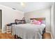 Bright bedroom with wood floor, desk, and natural light at 3823 N Oak Dr # K22, Tampa, FL 33611