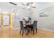 Cozy dining area with stylish seating, a ceiling fan, and serene decor, perfect for everyday meals at 3823 N Oak Dr # K22, Tampa, FL 33611