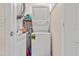Compact laundry area with stacked washer and dryer units at 3823 N Oak Dr # K22, Tampa, FL 33611