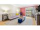Cozy living room with hardwood floors, comfortable seating, and a sliding glass door to a balcony at 3823 N Oak Dr # K22, Tampa, FL 33611