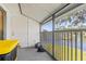 Screened patio with serene lake view and outdoor access at 3823 N Oak Dr # K22, Tampa, FL 33611