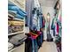 Organized walk-in closet with ample hanging and shelf storage at 3823 N Oak Dr # K22, Tampa, FL 33611