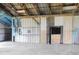Spacious barn interior with metal walls, concrete floor, and wooden framework at 3940 E Knights Griffin Rd, Plant City, FL 33565