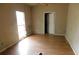 A bright bedroom with wood flooring at 3940 E Knights Griffin Rd, Plant City, FL 33565