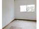 Empty bedroom features white walls, tile floors, and one window at 3940 E Knights Griffin Rd, Plant City, FL 33565