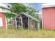 A greenhouse stands on an overgrown lot at 3940 E Knights Griffin Rd, Plant City, FL 33565