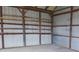 Barn interior features wooden beams and metal walls at 3940 E Knights Griffin Rd, Plant City, FL 33565