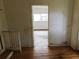 Interior view with wood floors and doorway leading to another room at 3940 E Knights Griffin Rd, Plant City, FL 33565