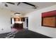 Spacious living room with checkered floors, transitioning into the adjacent kitchen area at 3940 E Knights Griffin Rd, Plant City, FL 33565