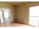 A view of a living room that has wood laminate floors and a doorway at 3940 E Knights Griffin Rd, Plant City, FL 33565