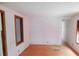 Empty living room featuring hardwood floors and natural light at 3940 E Knights Griffin Rd, Plant City, FL 33565