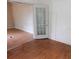 The living room has wood floors and a glass door to the side at 3940 E Knights Griffin Rd, Plant City, FL 33565